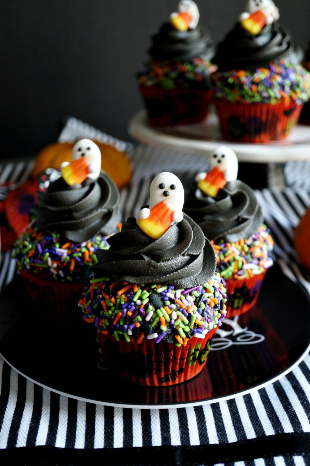 Picture of: vegan pumpkin cupcakes with dark chocolate sprinkle frosting  #HalloweenTreatsWeek